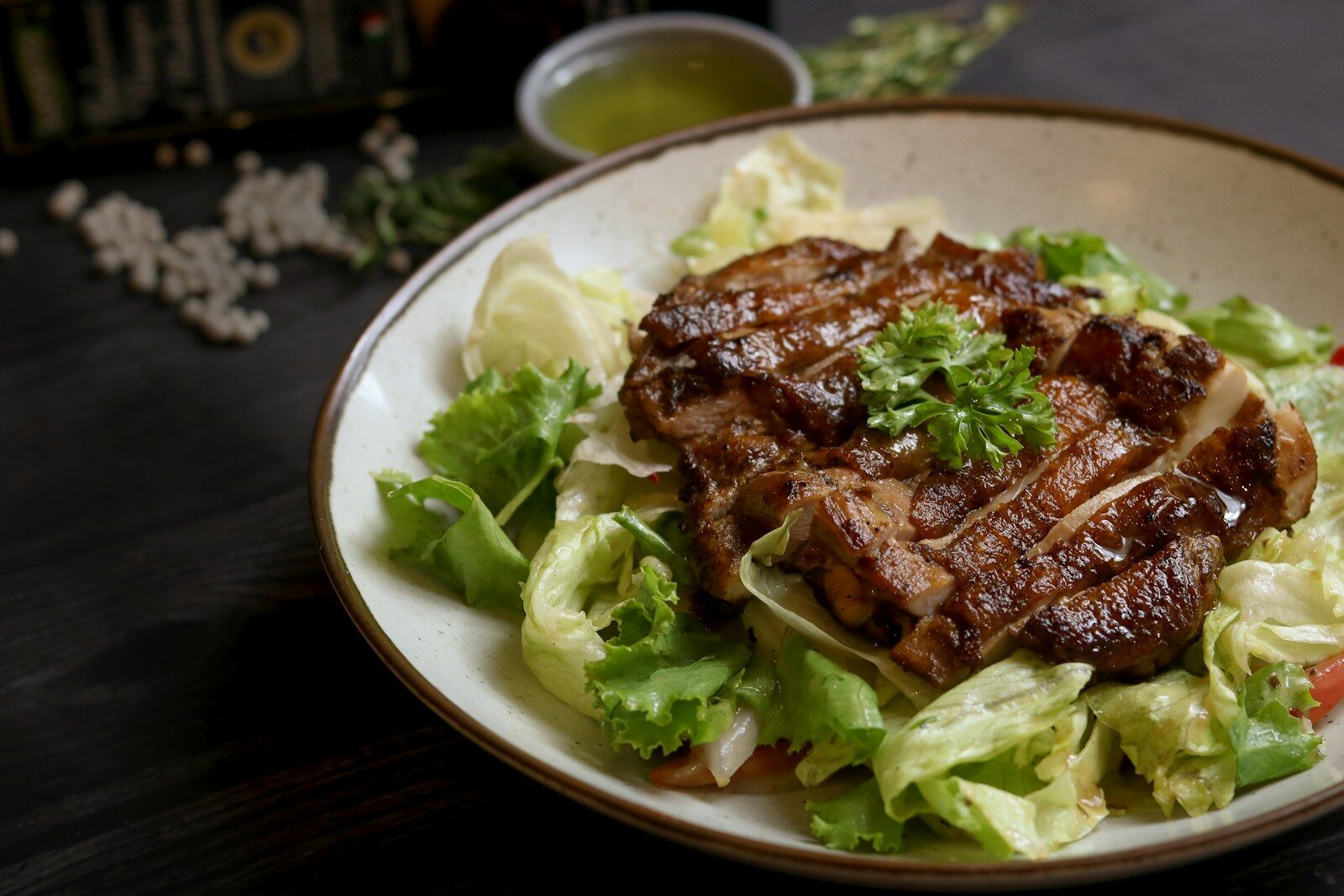 Delicious grilled chicken salad with fresh greens and dressing